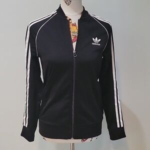 Vintage ADIDAS jogger full zip jacket.  Stripes down the sleeves.   Classic
